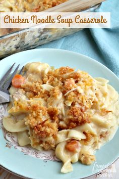 chicken noodle soup casserole on a blue plate with a fork next to it