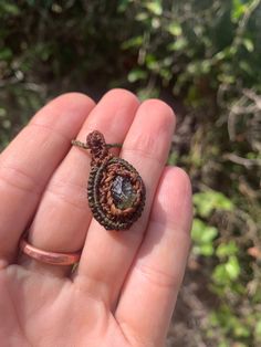 Beautiful little genuine Moldavite wrapped  in olive green and rust brown tread with micro macrame technique. It's fully adjustable.                                  Because it literally fell from the stars, Moldavite is highly respected and revered in the spiritual community. It has an intense frequency and even when touching it you can feel this energy surge right through. It's a stone that certainly turns up the dial when it comes to accelerating spiritual and emotional journeys and this can Micro Macrame Necklace, Spiritual Community, Raw Fluorite, Ethiopian Opal Ring, Jasper Earrings, Micro Macramé, Crystal Necklaces, Green Gems, Macrame Necklace