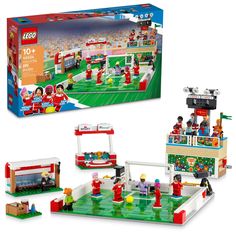 the lego set is designed to look like it's in a football field with people playing