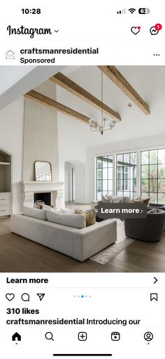 a living room filled with furniture and a fire place in the middle of a room