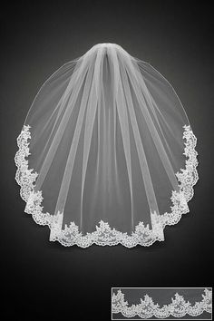 wedding veil with lace edge on black background