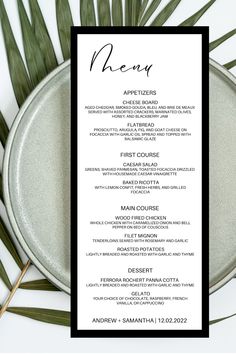 the menu for an event is displayed on a plate with palm leaves and other items