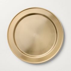 an empty gold plate on a white background