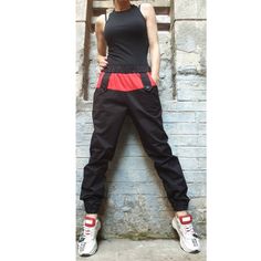 Sport elegant black red pants🤩 Extravagant designs and high quality fabrics. The item from the pictures is size S  For more information feel free to ask questions. Material &Care  Cotton textiles  Machine wash 30oC Hand wash at low temperatures Do not machine dry Medium hot iron Sizing  We make sizes from xs to 5xl as well as customized measures.So don't hesitate to contact us and make one for you. 🛫🎁Shipping🎁 🛬 STANDARD SHIPPING   Europe : 6-8 business days USA&Canada : 8-10 business days Everywhere else :10-20 business days DHL EXPRESS SHIPPING Europe: 2-3 business days USA & Canada: 2-3 business days Everywhere else: 3-6 business days We are glad that you choose our shop. XS (US 2, UK 6) Bust: around 33.5" / 85 cm Waist :around 26" / 66 cm Hips: around 36" / 91 cm Height: 5'3" / 16 Black Cotton Pants For Alternative Fashion, Stretch Cotton Punk Pants, Red Punk Style Pants For Streetwear, Red Punk Pants For Streetwear, Black Fitted High-waisted Parachute Pants, Red Casual Bottoms For Alternative Fashion, Casual Red Bottoms For Alternative Fashion, Edgy Red Pants For Streetwear, Edgy Red Cotton Bottoms