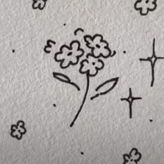 some flowers are drawn on the paper