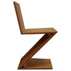 a wooden chair that is shaped like an x