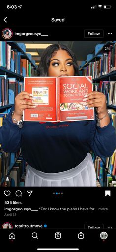 a woman holding up two books in front of her face