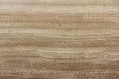 a close up view of some wood grains on a table top, with light brown tones