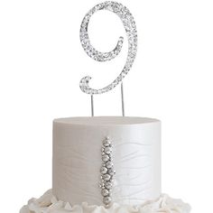 a wedding cake with the number nine on top