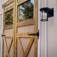 a barn door with a lantern on the side