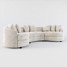 the curved sectional sofa has many pillows on it