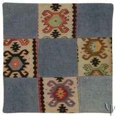 an old patchwork rug with different colors and designs on it's sides,