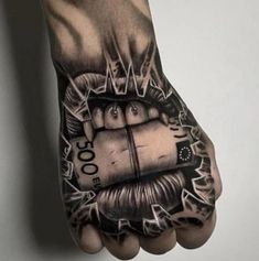 a person's hand with a tattoo on it and money coming out of the palm