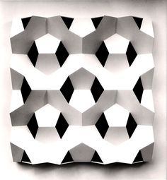 an abstract pattern made up of black and white shapes