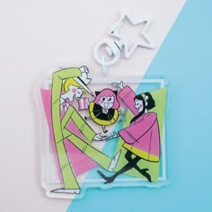 an acrylic cutout of two people dancing on a blue and pink background