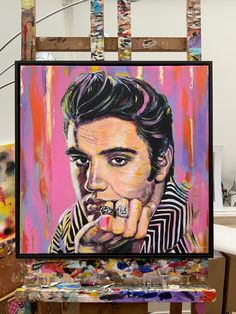 Elvis Presley original painting, by British artist Marie O'Hara. Acrylic and oil with gold leaf and framed in smart black wood. Fixtures on reverse, so is ready to hang in your space. Ideal for Elvis Presley fans.  This painting measures 25 x 25 inches (including frame) and is embellished with gold leaf.  The painting is framed in a premier black wooden frame and is fitted with attachments on the back so the picture is ready to hang. The artist has captured Elvis Presley's charismatic and broodi Elvis Print, Elvis Painting, Elvis Portrait, Elvis Presley Portrait, Elvis Quotes, Rock Wall Art, Elvis Art, Iconic Artwork, Rock Wall