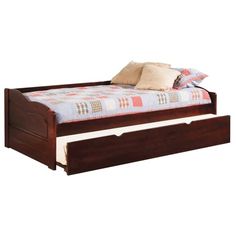 a bed with two drawers underneath it and a pillow on top of the bottom drawer