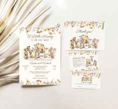 the wedding stationery is decorated with flowers and teddy bears on it's cards