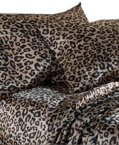 a leopard print comforter set with matching pillows