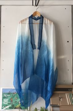 This piece was hand dyed with indigo using a dip dye technique. The kimono itself is a light weight silk with a silk organza collar. Edges have been hand rolled. This is the perfect piece to dress up or down, or even wear around the house over pjs. The light weight of the silk allows it to flow elegantly behind the wearer, for an easy comfortable look. The length comes to between knee and mid thigh depending on height. Dip Dye Clothes, Tie Dye Silk Dress, Organza Collar, Ladies Poncho, Silk Dyeing, Silk Organza, Silk Kimono, Dip Dye, Diy Fashion