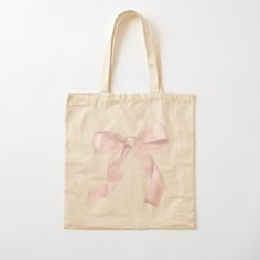 a bag with pink ribbon on it