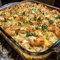 a casserole dish with shrimp and cheese