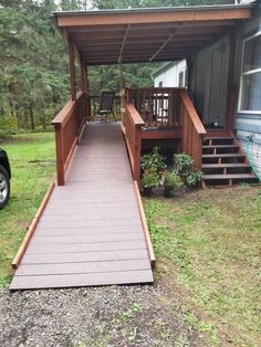 a wooden walkway leading to a mobile home