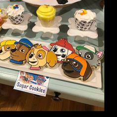 cupcakes with cartoon characters are on display