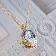 Introducing the Annie Mae necklace! Suitable for one who is truly wild and free at heart.  Featuring a blue agate cameo necklace framed with a golden silver sterling 925 textured frame and chain. Total necklace length: 44cm Cameo pendent: 1 X 1.5 cm AVAILABLE ALSO IN SILVER! Check out our Cameo Necklaces section! Design: a lady with long loose hair, gazing romantically. Shape: Oval. Agate is a variety of banded Chalcedony, which is a variety of the mineral Quartz, known for helping you express y Wedding Cabochon Medallion Necklace, Blue Cameo Jewelry For Wedding, Blue Cameo Necklace For Wedding, Formal Blue Cameo Jewelry, Victorian Blue Cameo Jewelry, Blue Cameo Jewelry For Formal Occasions, Blue Cameo Necklace For Formal Occasions, Elegant Cameo Locket Necklace For Wedding, Sterling Silver Cameo Jewelry For Gift