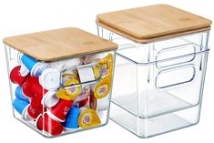 two clear storage containers with wooden lids and lids on the sides, each containing different types of condiments