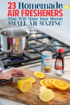 a person cutting up lemons on top of a wooden cutting board next to a stove