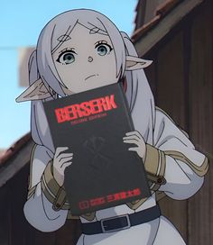 an anime character holding a book with the title berserk on it