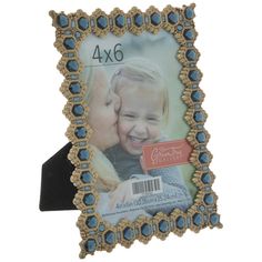 a blue and gold frame with an image of a child kissing on the cheek, in front of a white background