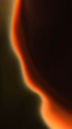 a blurry image of an orange and black object