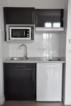 the small kitchen is clean and ready for us to use in its new home or apartment