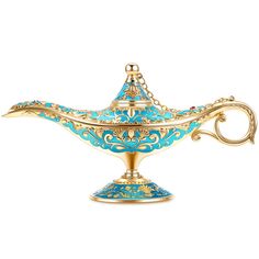 an ornate blue and gold teapot on a white background with clipping for text