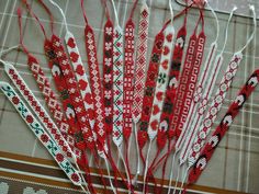 some red and white beaded sticks on a table