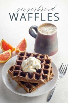 a white plate topped with waffles next to a cup of coffee