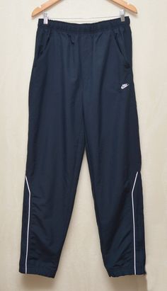 Vintage Nike Nylon Track Pants Embroided Logo Swoosh sz M Excellent used condition, without any defects! Size M PLEASE CHECK MEASUREMENTS!! waist: 14'5" inches \ 37 cm full length: 42'1" inches \ 107 cm leg opening: 7" inches \ 18 cm inseam: 30'7" inches \ 78 cm rise: 11'8" inches \ 30 cm If u have any questions please contact me before purchase Nike Vintage Pants, Nike 2000s, Vintage Nike Track Pants, 2000s Men, Nylon Track Pants, Track Pants Outfit, Nike Track Pants, Men's Sportswear, Nike Vintage