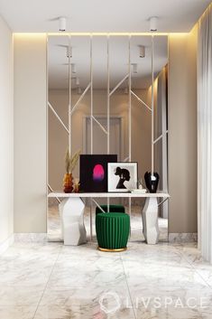 an office with marble floors and walls, including a white desk surrounded by two green vases