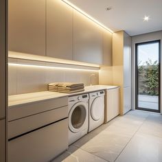 a washer and dryer in a room with large doors leading to the outside