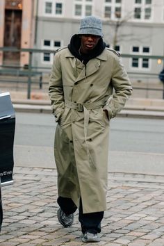 Florian Alexander wears the FILIPPA K Spring Summer 2024 Trench Coat in Khaki Green on the streets of Copenhagen. Explore the collection at filippa-k.com #FILIPPAK #SS24 #TrenchCoat #ScandianvianStyle #CopenhagenFashionWeek #SpringFashion #SummerStyle Copenhagen Fashion Week, Spring Summer 2024, Khaki Green, Summer 2024, The Streets, The Collection, Copenhagen