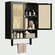 a bathroom cabinet with towels hanging from it's sides and two shelves on the wall