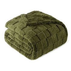 two towels folded on top of each other in green color, one is folded over the other