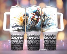 two mugs with the image of a motorcycle rider on them are shown in front of a blurry background