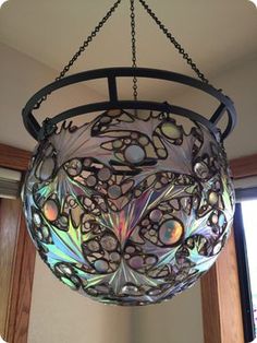 a circular light fixture hanging from a ceiling