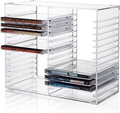 an acrylic storage rack holds several dvd's