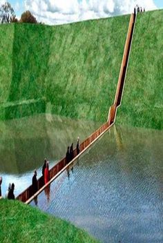 people are standing on the edge of a bridge over a body of water that is partially submerged