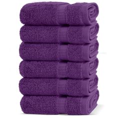 six purple towels stacked on top of each other