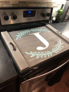 an oven with the letter j painted on it